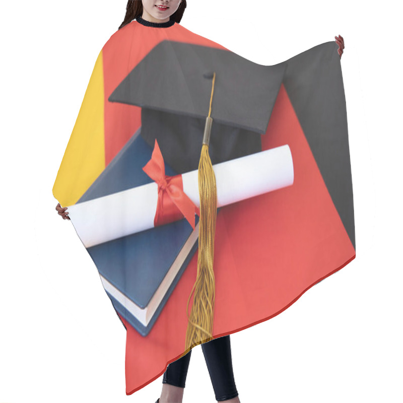 Personality  Graduation Diploma And Academic Hat On The Background Of The Flag Of Germany. Concept - Graduation Day. German Education. Hair Cutting Cape