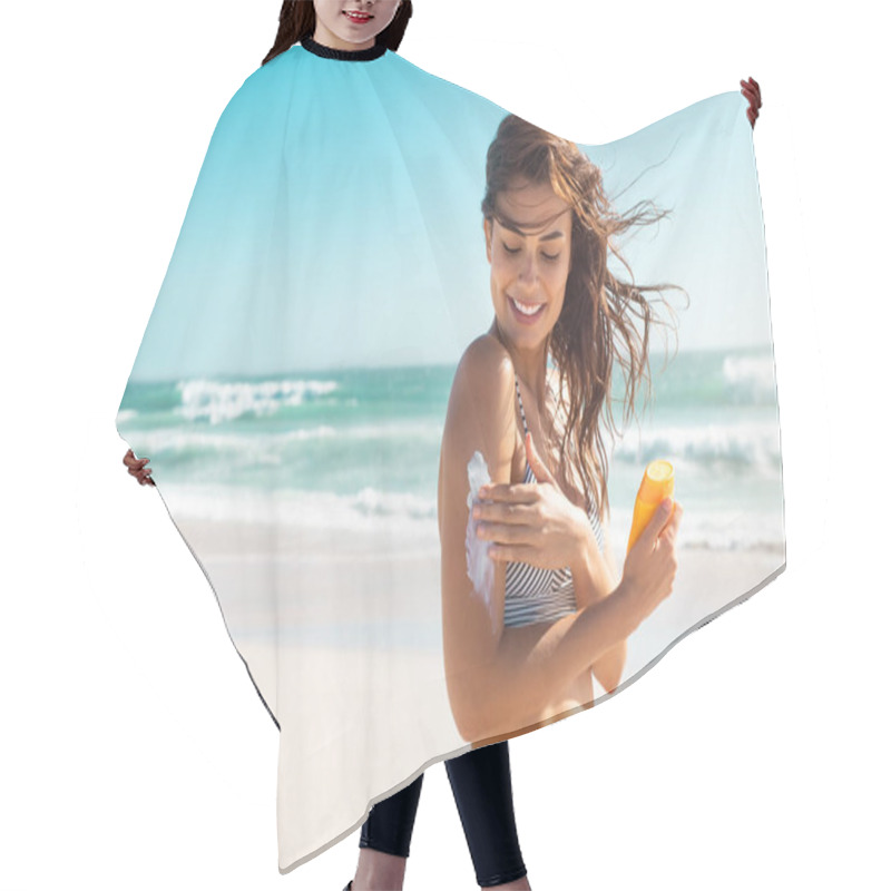 Personality  Beautiful Young Latin Woman Applying Suntan Lotion At Beach With Copy Space. Tanned Girl In Bikini Applying Sunscreen On Shoulder At Tropical Beach. Brunette Woman Wearing Swimsuit And Protecting Skin With Sunblock Cream From UV And UVB Sunrays. Hair Cutting Cape