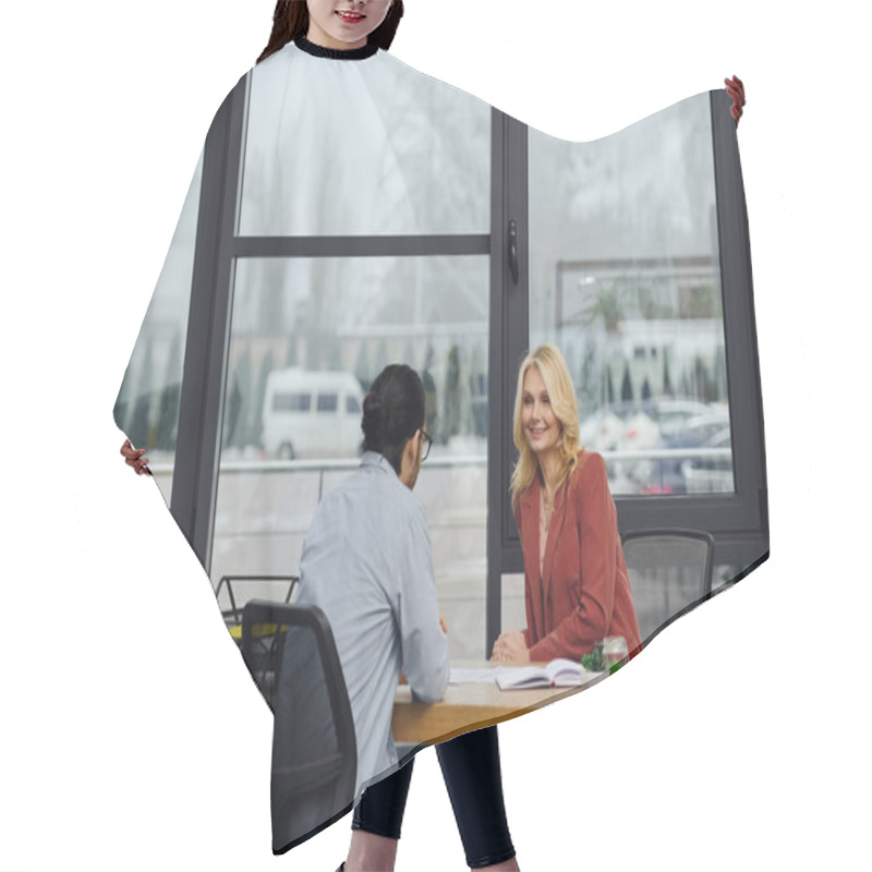 Personality  A Woman Engages In Conversation With A Man During Job Interview. Hair Cutting Cape