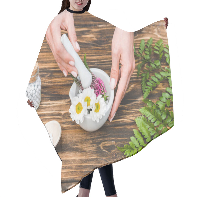 Personality  Cropped View Of Woman Holding Pestle Near Mortar With Flowers And Green Leaves On Wooden Table  Hair Cutting Cape