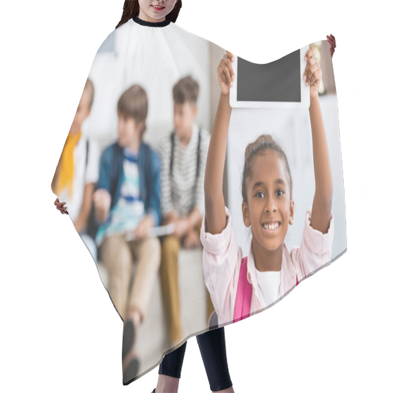 Personality  Selective Focus Of African American Schoolgirl Holding Digital Tablet With Blank Screen In Classroom  Hair Cutting Cape