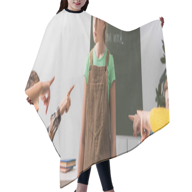 Personality  Panoramic Shot Of Cruel Classmates Pointing With Fingers At Bullied Schoolgirl In Classroom  Hair Cutting Cape