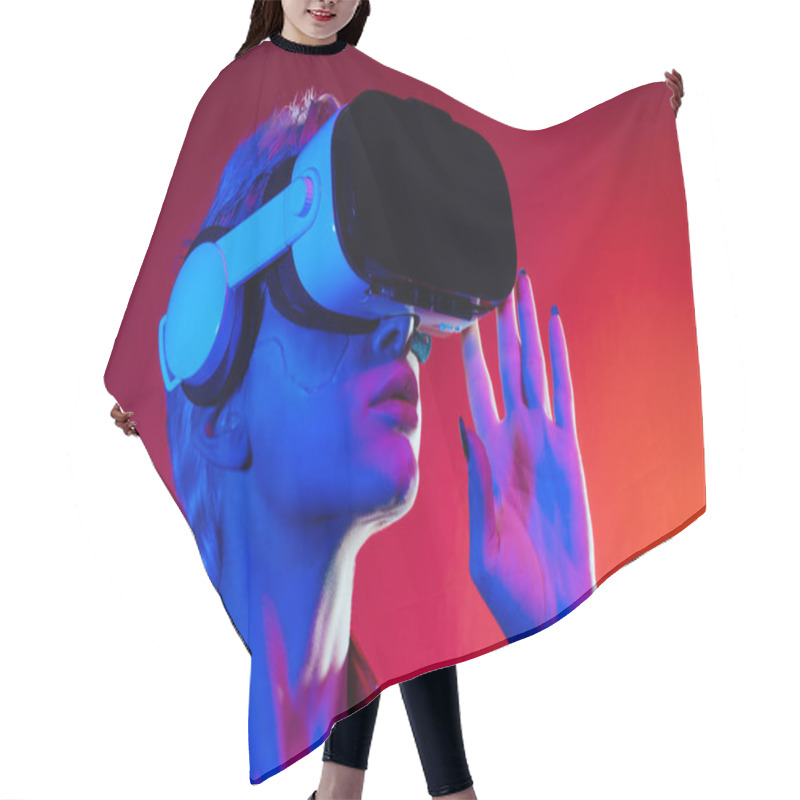 Personality  Representation Of A Bionic Super Human With Advanced Technology Parts As Vr Visors And Gadgets Playing In A Mixed Reality Training Room. Futuristic Cyberpunk Evolution Of Human Mankind And AI Hair Cutting Cape