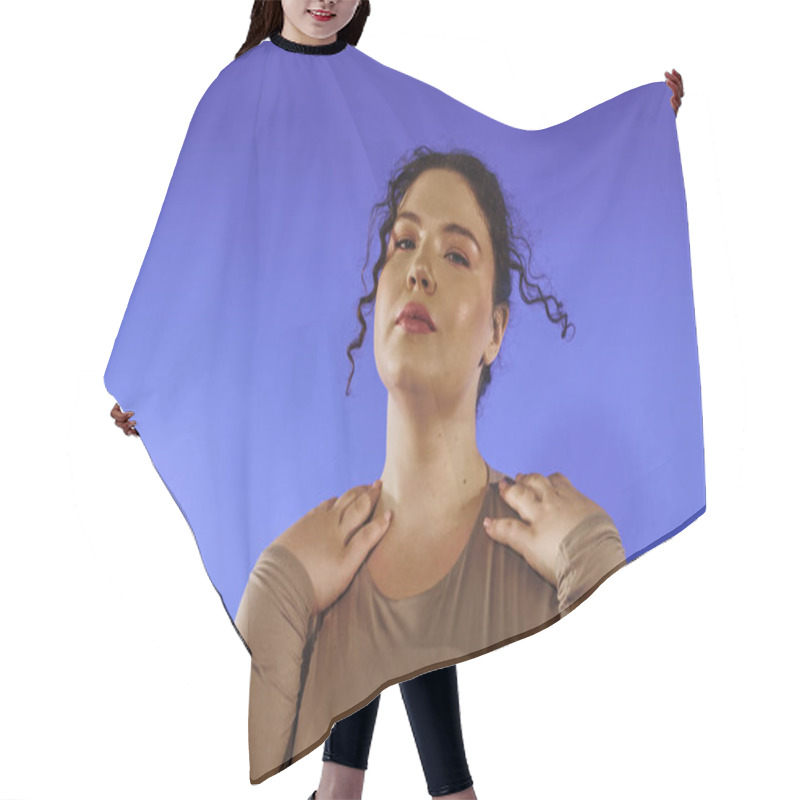 Personality  A Confident Plus Size Woman Poses Gracefully Against A Vivid Blue Background. Hair Cutting Cape