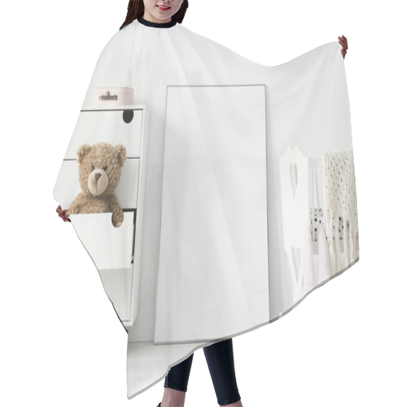 Personality  Plush Toy In Cabinet Next To Poster With Mockup And Cradle In Baby's Bedroom Interior. Real Photo. Place For Your Graphic Hair Cutting Cape