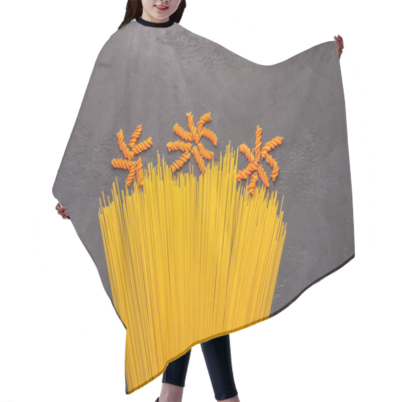 Personality  Orange And Yellow Macaroni Spaghetti Background Concept Like A Flowers On Dark Background. Italian Pasta Cooking Illustration Hair Cutting Cape