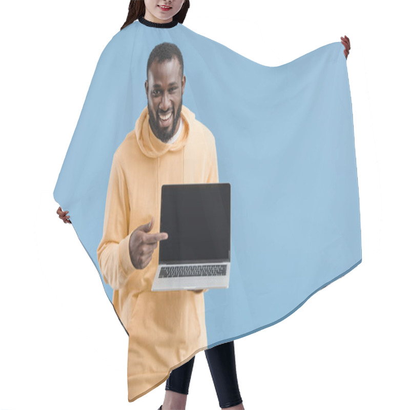 Personality  Laughing Young African American Man Pointing By Finger At Laptop With Blank Screen Isolated On Blue Background Hair Cutting Cape