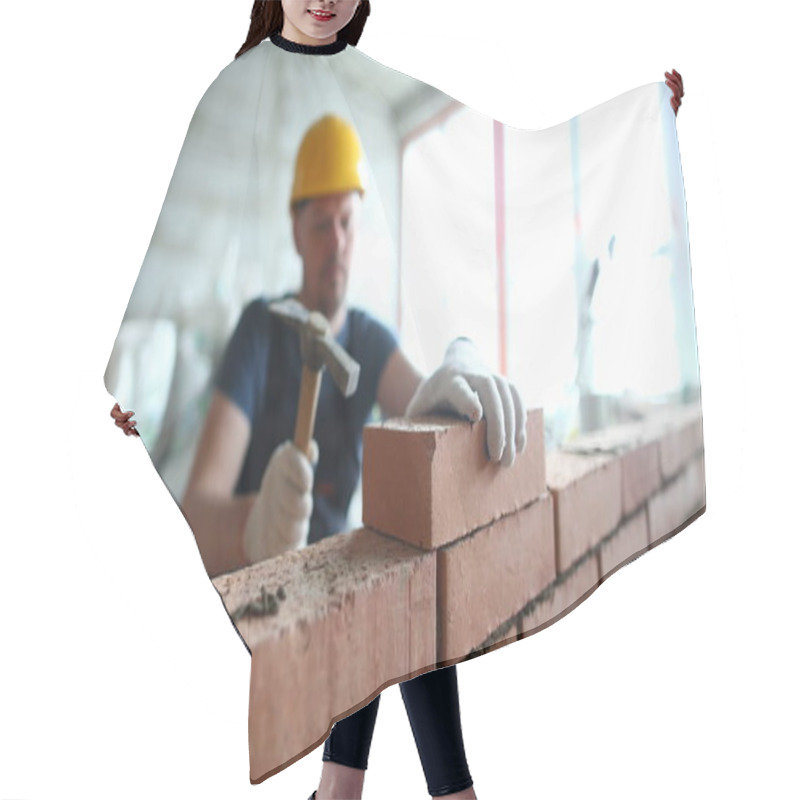 Personality  Portrait Of Skilled Man Constructing Big Concrete Wall And Using Special Hammer To Properly Fulfill Task To Gently Lay Bricks On Unfinished Structure. Building Concept Hair Cutting Cape