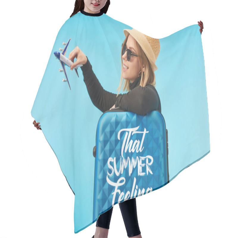 Personality  Blonde Happy Girl In Sunglasses And Straw Hat Plating With Toy Plane Near Blue Travel Bag With That Summer Feeling Lettering Isolated On Blue Hair Cutting Cape