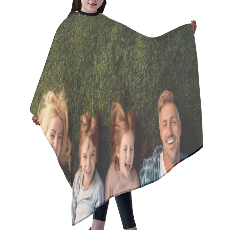 Personality  Family Vacation. Happy Family Of Four Lying On Green Grass Hair Cutting Cape