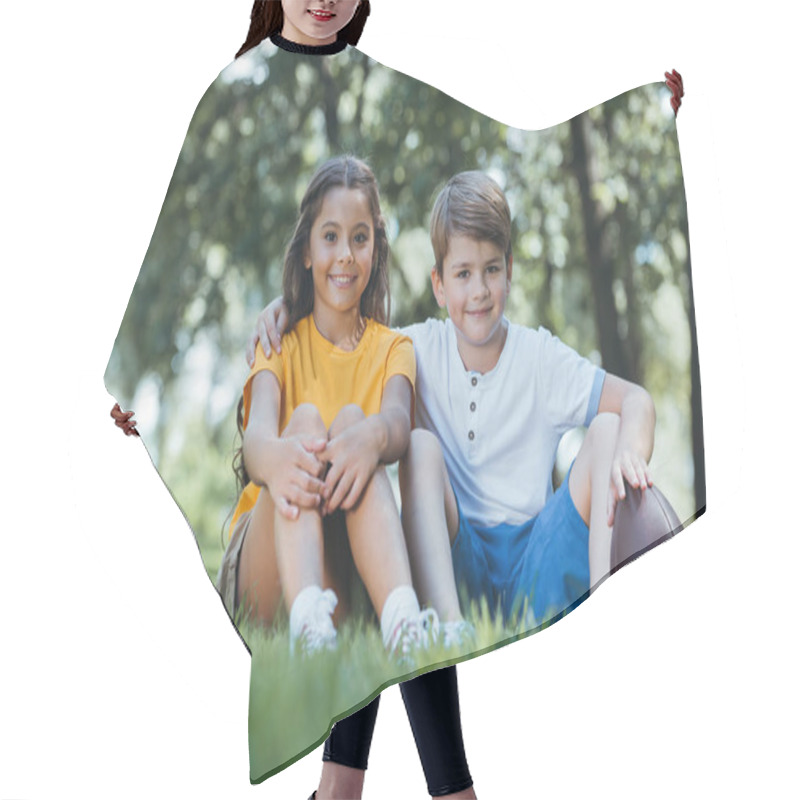 Personality  Cute Happy Kids With Soccer And Rugby Balls Sitting On Grass And Smiling At Camera Hair Cutting Cape