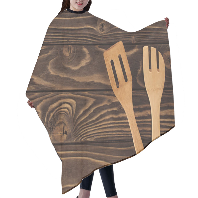 Personality  Elevated View Of Two Different Wooden Spatulas On Table  Hair Cutting Cape