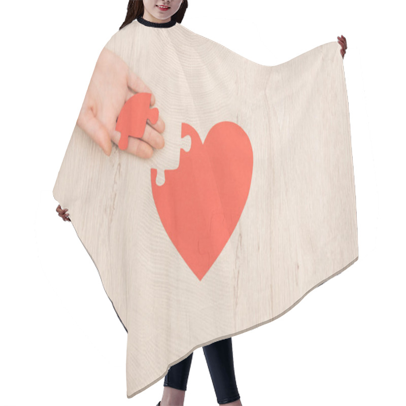 Personality  Partial View Of Woman Holding Puzzle Of Heart On Wooden Background  Hair Cutting Cape