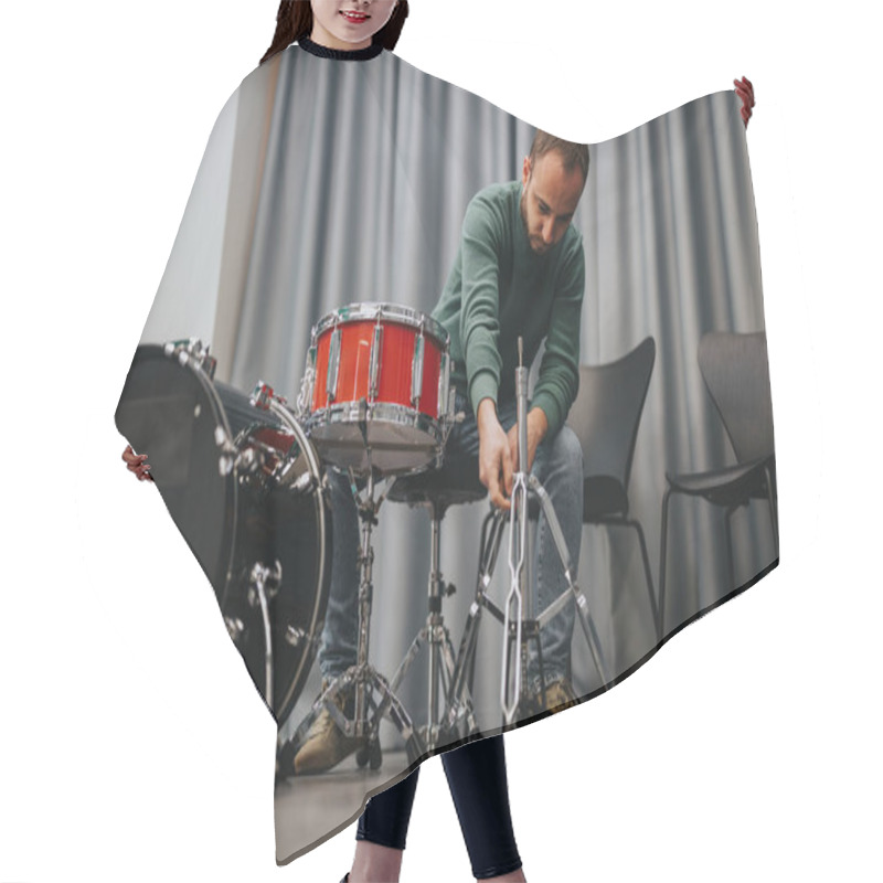 Personality  A Man Prepares A Drum Kit In A Cozy Rehearsal Room, Adjusting The Stands And Ensuring Everything Is In Place. The Black And Red Drums Contrast With The Muted Background. Hair Cutting Cape