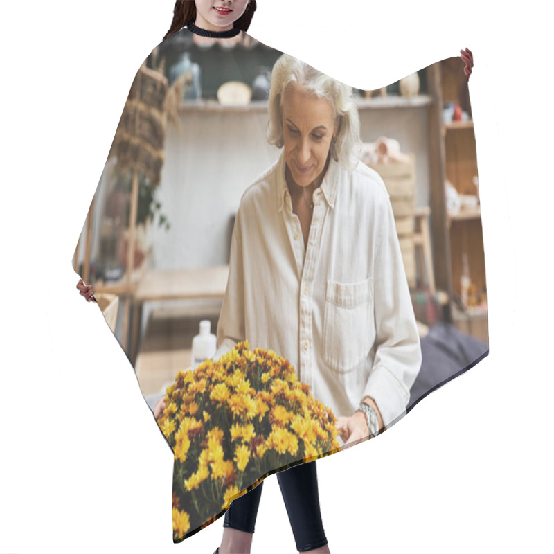 Personality  A Beautiful Mature Woman Carefully Arranges Bright Flowers In A Cozy Artisan Workshop. Hair Cutting Cape