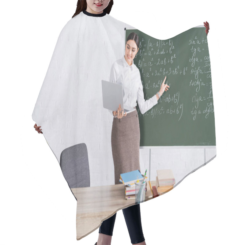 Personality  Smiling Teacher Pointing At Mathematic Equation During Video Call On Laptop In Classroom  Hair Cutting Cape