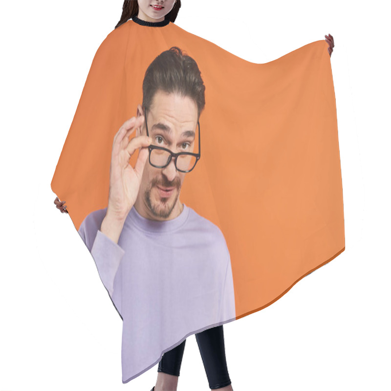 Personality  Bearded Man In Purple Sweatshirt Wearing Eyeglasses On Orange Background, Fashion Trends Hair Cutting Cape