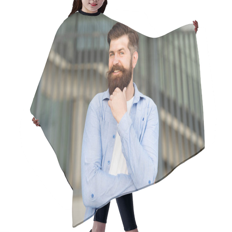 Personality  Having Extensive Facial Hair Growth. Happy Hipster With Stylish Beard And Mustache Hair On Urban Background. Bearded Man Smiling With Unshaven Face Hair. Brutal Guy With Shaped Beard And Styled Hair Hair Cutting Cape