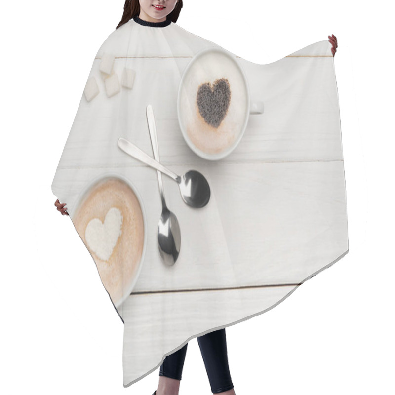 Personality  Top View Of Cups With Cappuccino And Latte Near Spoons And Sugar Cubes On White Wooden Background   Hair Cutting Cape