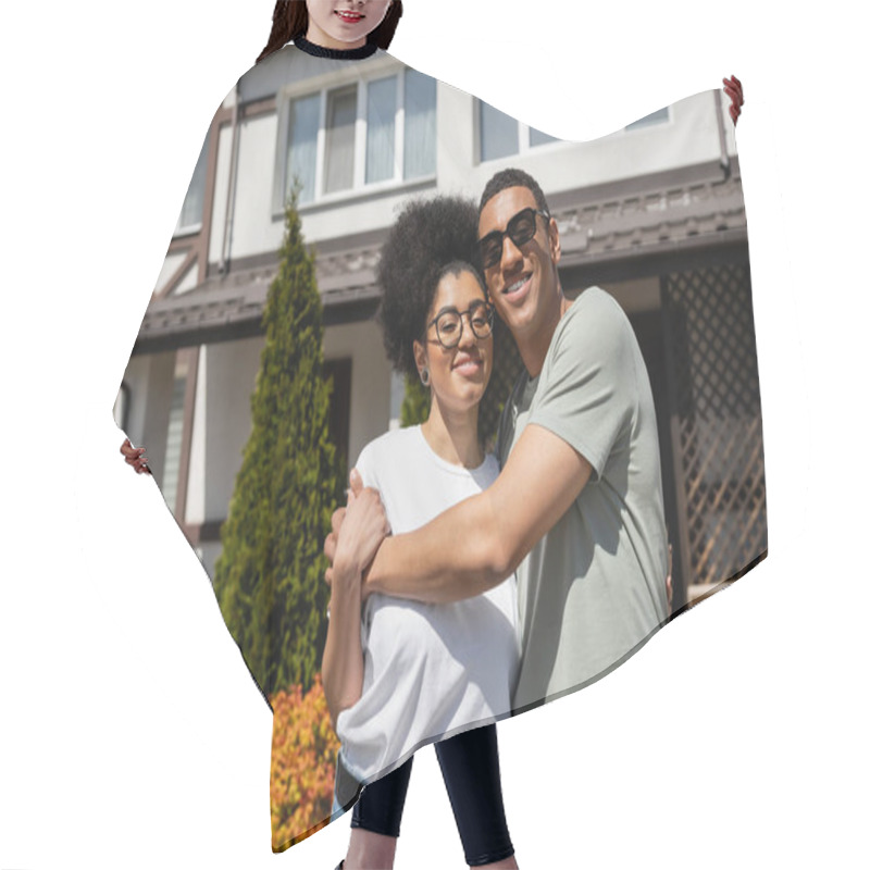 Personality  Smiling African American Man In Sunglasses Hugging Girlfriend While Standing Near New House Hair Cutting Cape