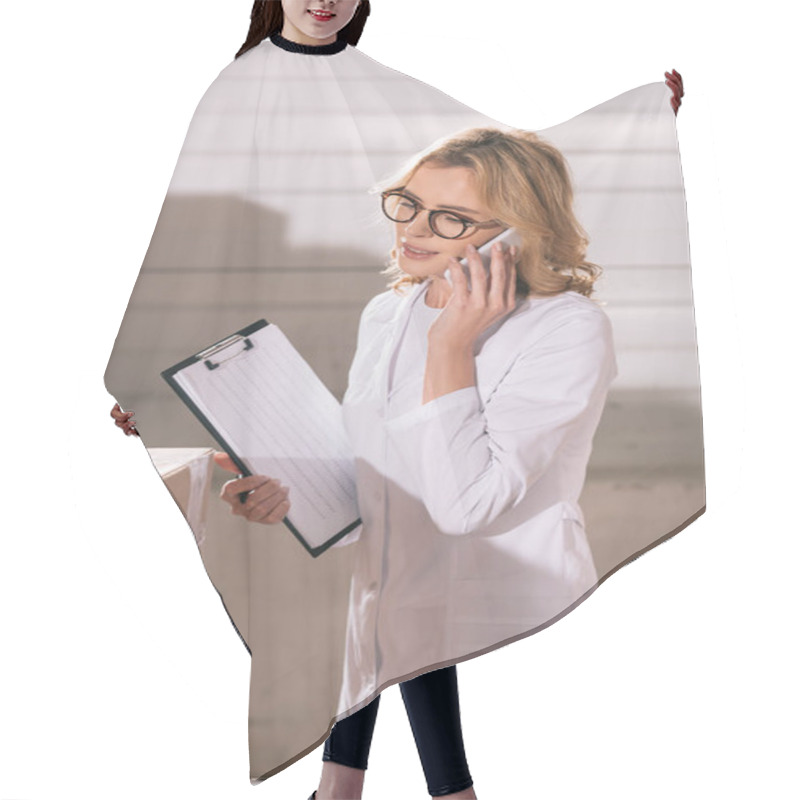 Personality  Smiling Storekeeper Talking On Smartphone While Holding Clipboard Hair Cutting Cape