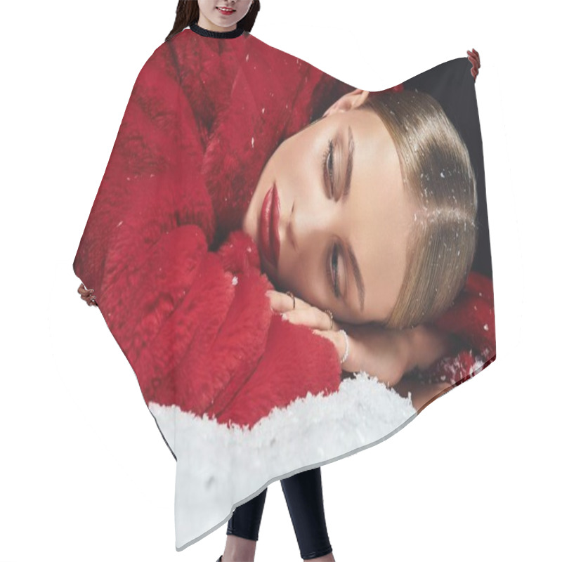 Personality  A Young Woman Relaxes Gracefully On Snow, Adorned In A Striking Red Coat Against A Dark Background. Hair Cutting Cape