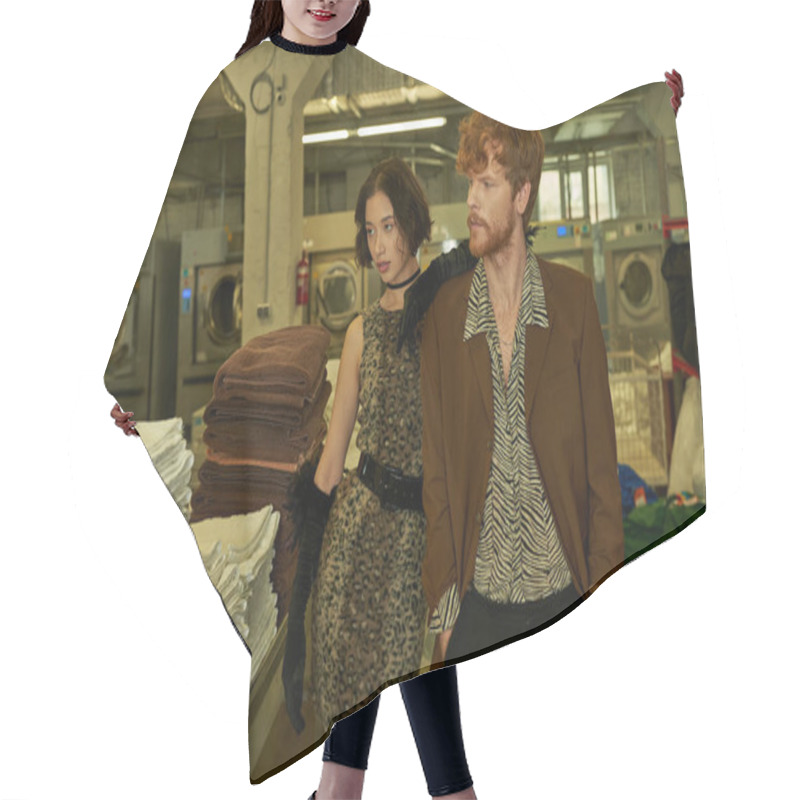 Personality  Trendy Redhead Man In Jacket Posing Near Young Asian Girlfriend In Dress In Coin Laundry Hair Cutting Cape