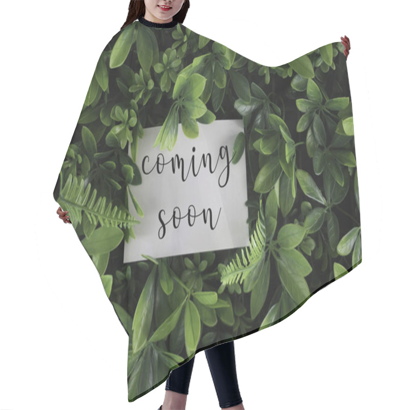 Personality  Green Leaves And White Paper Sheet Blank With Written Text: Coming Soon  Hair Cutting Cape