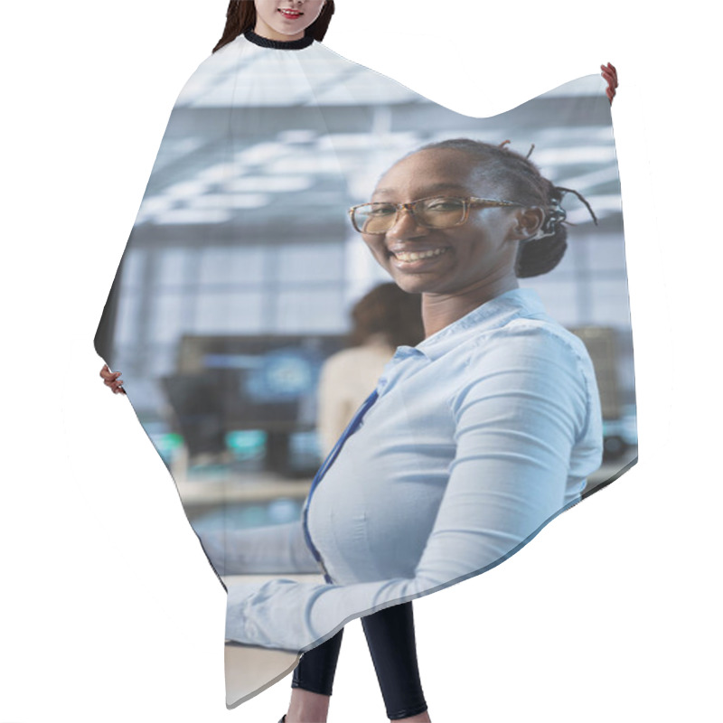 Personality  Portrait Of Smiling Technician In Data Center Coordinating Deployment Of Server Architecture, Improving Data Processing Speed. Happy Woman In Server Hub Configuring And Testing Equipment Hair Cutting Cape