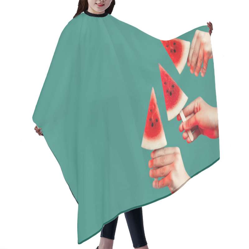 Personality  Hands Stretch Out Pieces Of Watermelon On A Stick. On A Green Background. Summer Concept Hair Cutting Cape