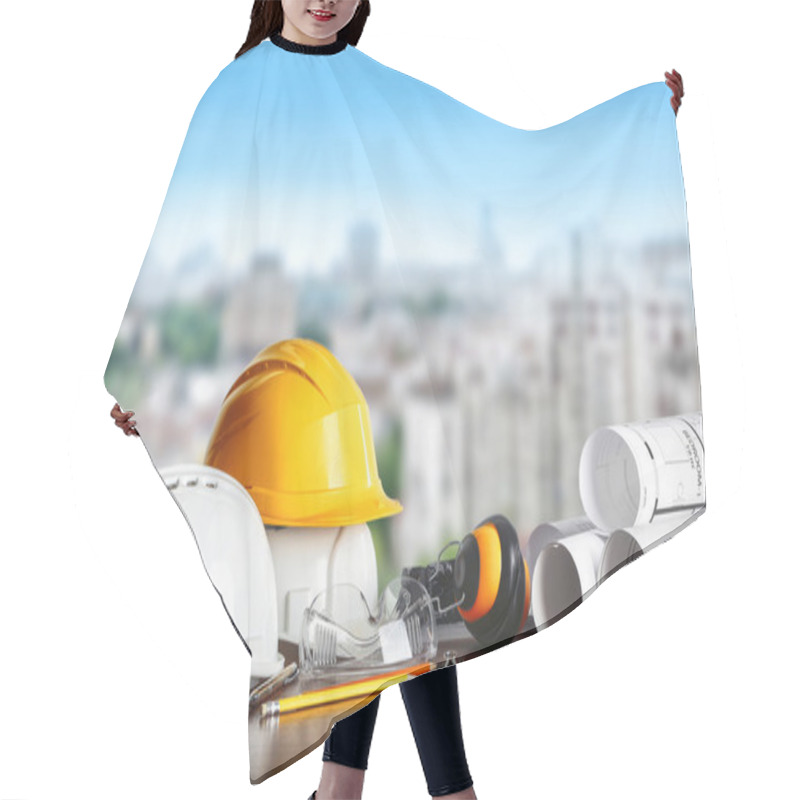 Personality  Construction Concept. Architect Equipment: Helmets, Blueprint And Pencil On The Table And View Of City Hair Cutting Cape