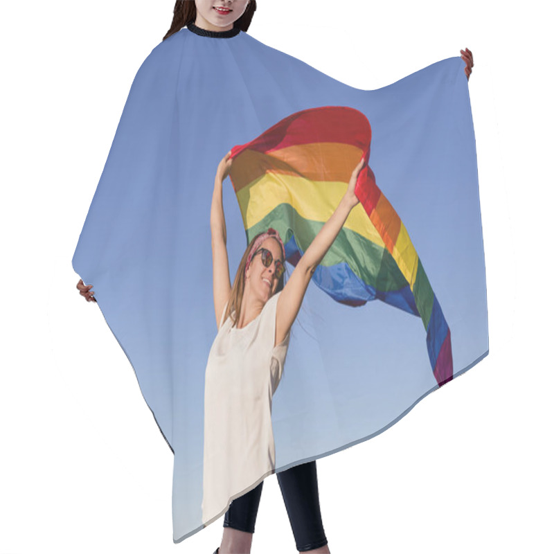 Personality  Woman Holding The Gay Rainbow Flag Over Blue Sky Outdoors. Happiness, Freedom And Love Concept For Same Sex Couples. LIfestyle Outdoors Hair Cutting Cape