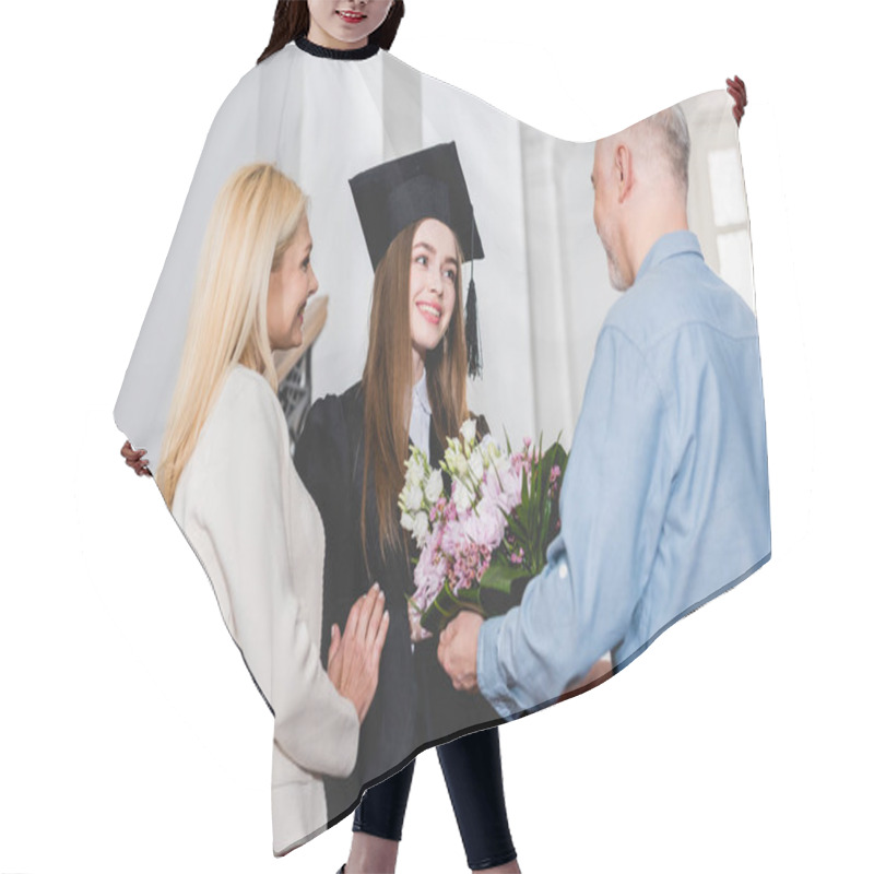 Personality  Happy Father Giving Flowers To Cheerful Daughter In Graduation Cap  Hair Cutting Cape