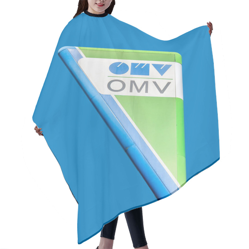 Personality  Bucharest/Romania - 08.18.2020: OMV Gas Station Logo In Buchrest On Blue Background. Hair Cutting Cape