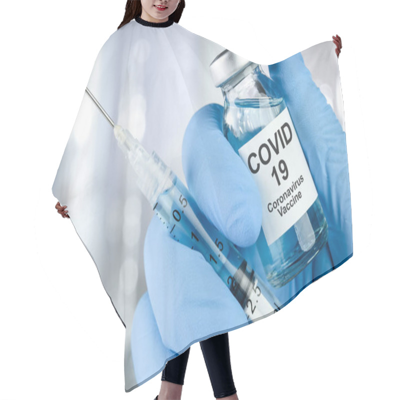 Personality  Healthcare Cure Concept With A Hand In Blue Medical Gloves Holding Coronavirus, Covid 19 Virus, Vaccine Vial Hair Cutting Cape