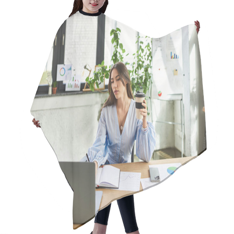 Personality  Brunette Woman Focuses Intently On Her Laptop While Sipping Coffee In A Stylish Office Space. Hair Cutting Cape