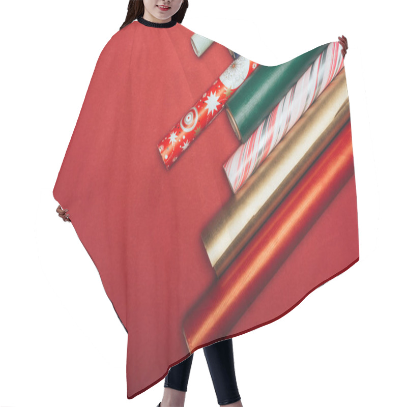 Personality  Top View Of Wrapping Paper Rolls On Red Hair Cutting Cape