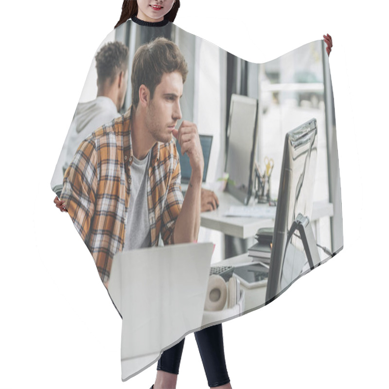 Personality  Selective Focus Of Serious Programmer Working Near African American Colleague In Office Hair Cutting Cape