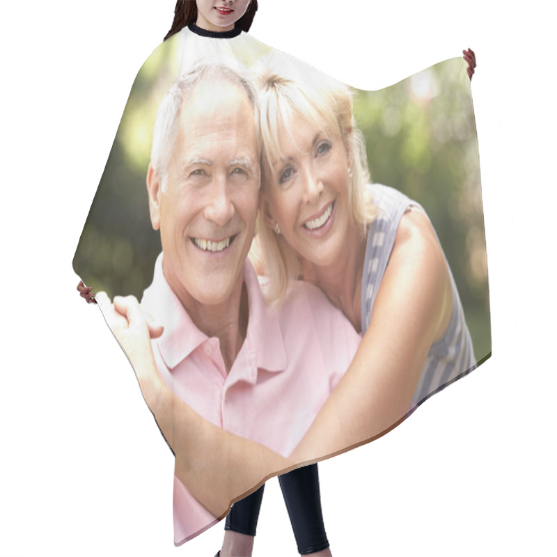 Personality  Senior Couple Relaxing Together In Park Hair Cutting Cape