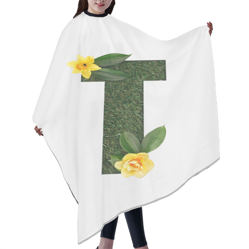 Personality  Top View Of Cut Out T Letter On Green Grass Background With Leaves And Yellow Daffodils Isolated On White Hair Cutting Cape