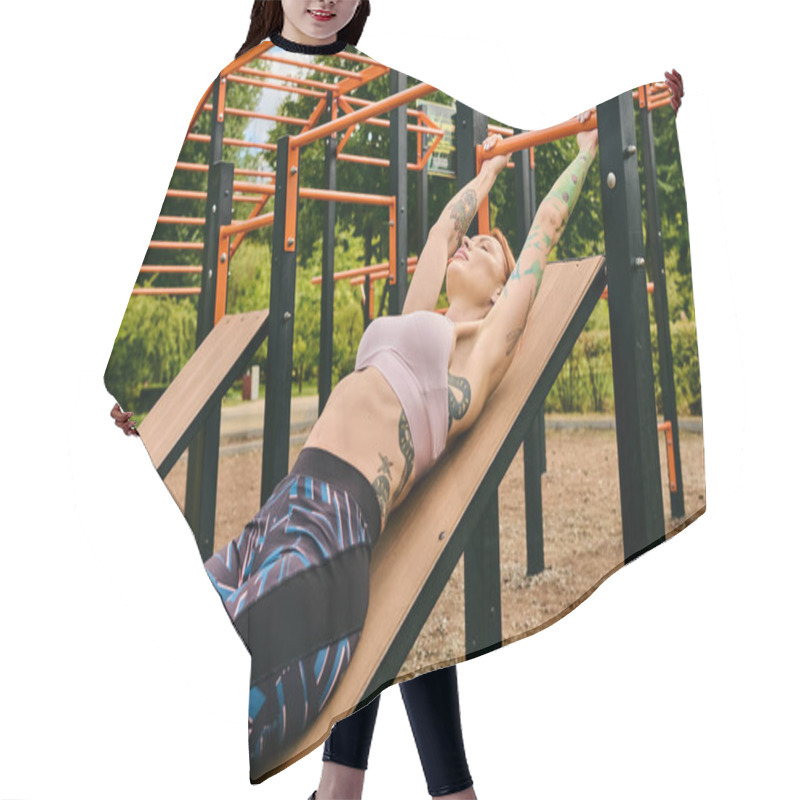 Personality  A Woman In Sportswear Lies Peacefully On A Wooden Bench During A Workout Session Outdoors. Hair Cutting Cape