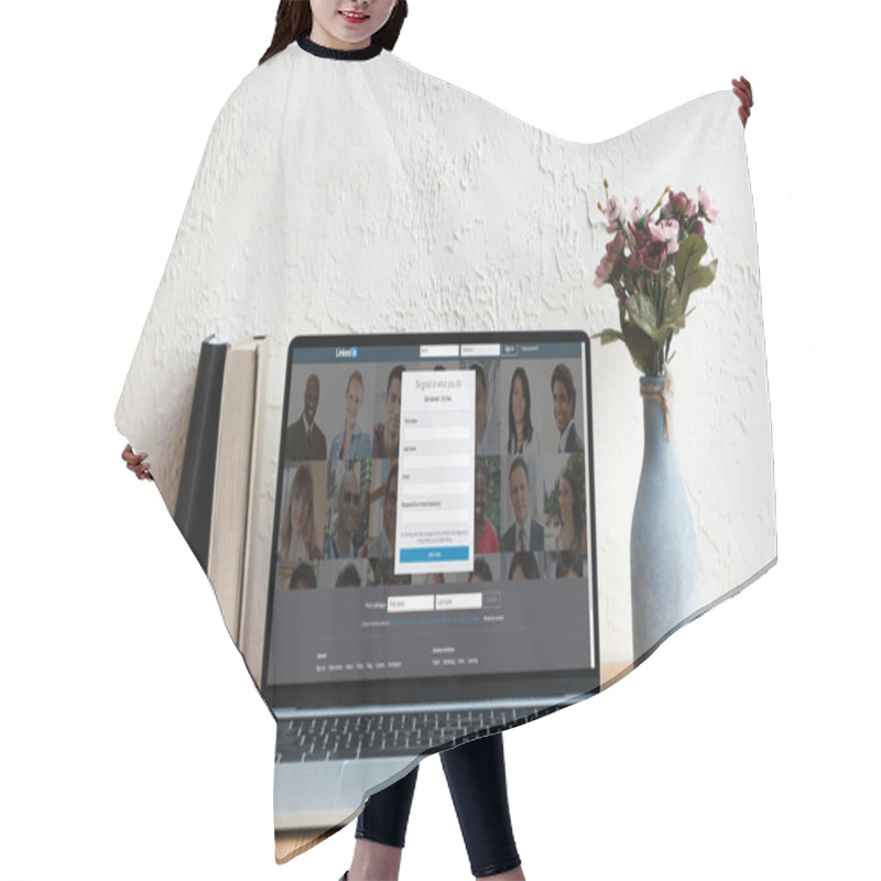 Personality  Laptop With Linkedin Website On Screen, Books And Flowers In Vase On Wooden Table Hair Cutting Cape