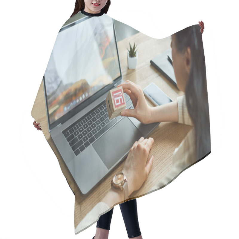 Personality  A Businesswoman Sitting At A Desk In A Modern Office, Working On A Laptop. Hair Cutting Cape