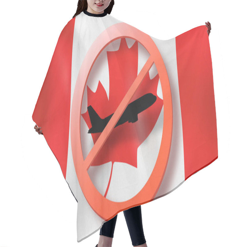 Personality  Forbbiden Sign With Crossed Out Black Plane On The Background Of Canadian Flag. Restriction Of Entry Into Canada. Coronavirus, Covid 19 Pandemic, Quarantine Concept. Hair Cutting Cape