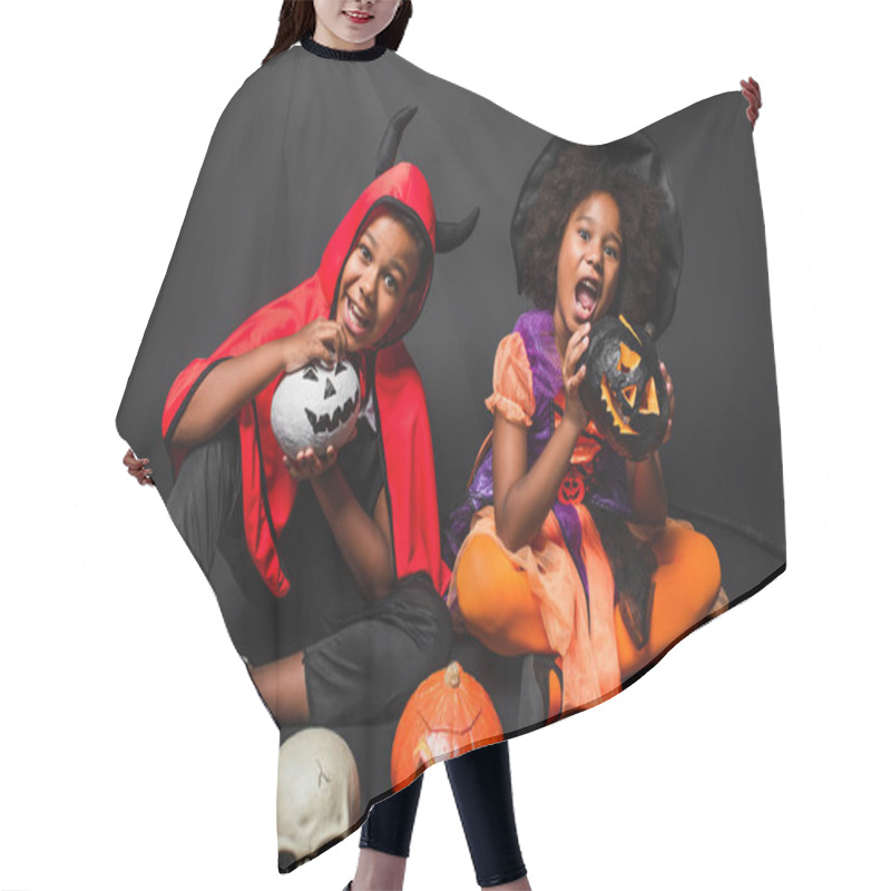 Personality  African American Siblings In Halloween Costumes Holding Carved Pumpkins On Black  Hair Cutting Cape