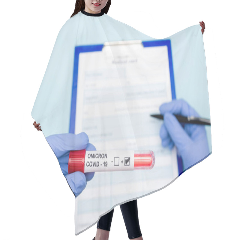 Personality  Cropped View Of Doctor With Positive Covid-19 Omicron Variant Test Writing On Blurred Clipboard On Blue Hair Cutting Cape