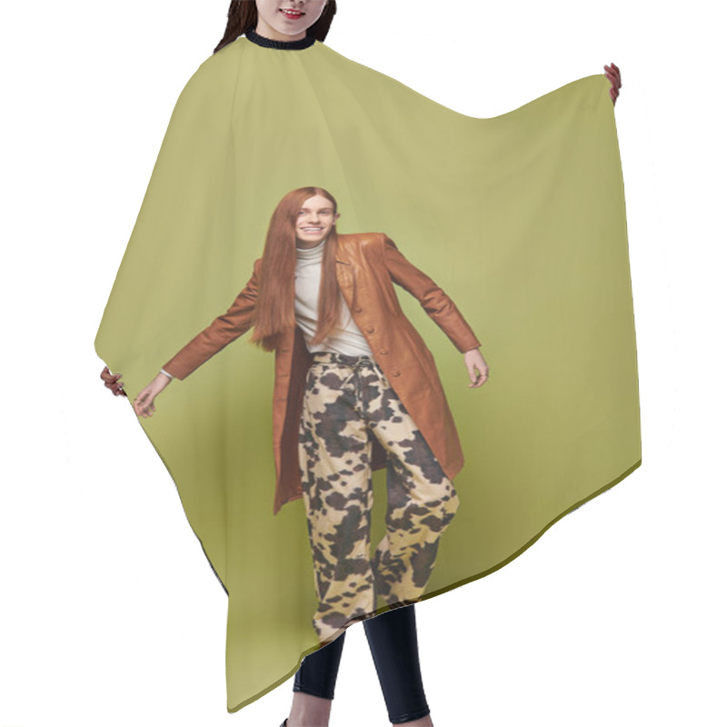 Personality  A Young Man With Long Red Hair Expresses Emotions In A Stylish Outfit Against A Green Backdrop. Hair Cutting Cape