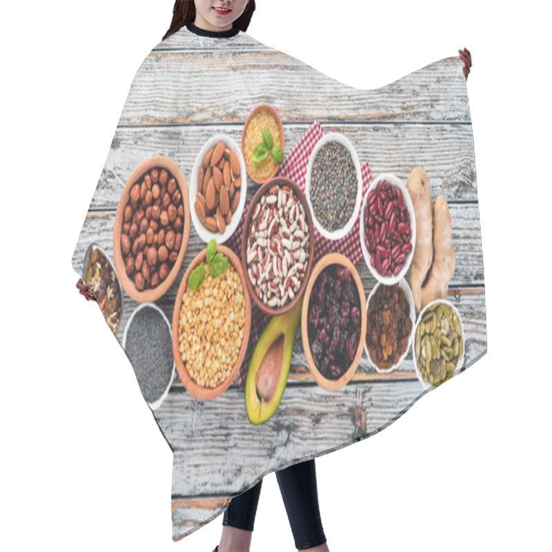 Personality  Superfoods Healthy Food. Nuts, Berries, Fruits, And Legumes. On A White Wooden Background. Top View. Free Copy Space. Hair Cutting Cape