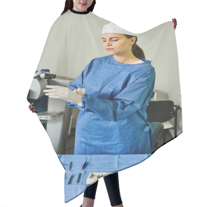 Personality  A Woman In A Surgical Gown Stands Beside A Table In A Medical Setting. Hair Cutting Cape