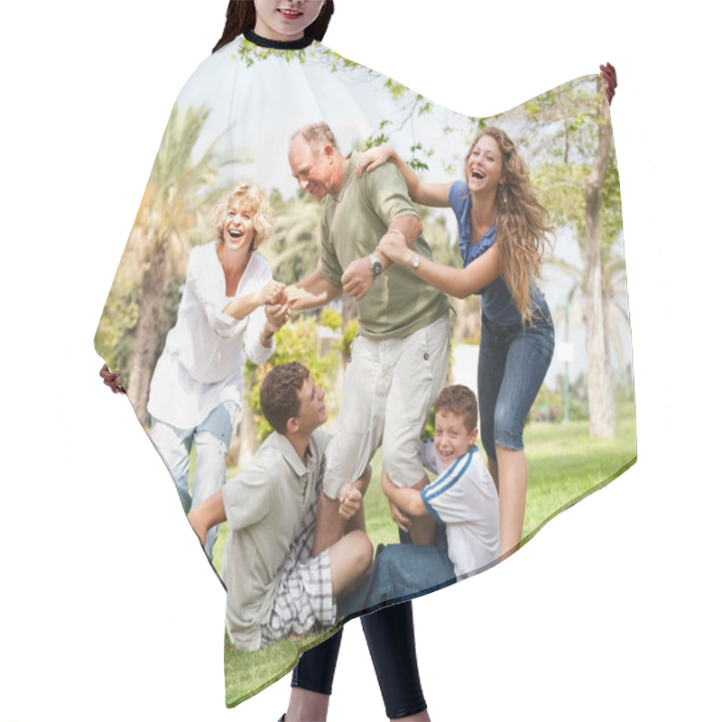 Personality  Family Holding Back Grandfather And Having Fun Hair Cutting Cape